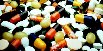 picture shows a collection of pills and capsules of medicine