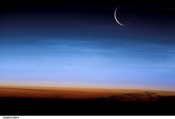 Crescent moon just over the horizon.