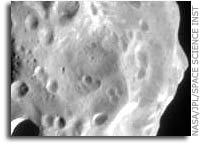 Phoebe Shows a Moon with a Battered Past