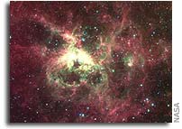 Stormy Cloud of Star Birth Glows in New Spitzer Image