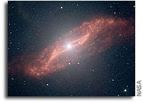Spitzer Spies Parallelogram-Shaped Galactic Meal