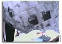 NASA's Spacewalking Astronaut Steve Robinson Completes Unique Repair