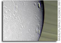 Cassini Views Dione, a Frigid Ice World
