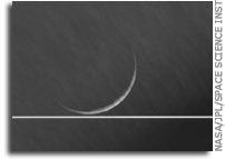A Crescent Tethys and Saturn's Rings