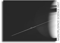 Dione and Saturn's Rings