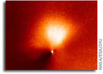 Hubble captures outburst from comet targeted by Deep Impact