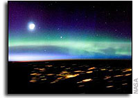 ISS Crew Photographs Aurora Borealis and city lights in Scandanavia