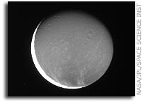 Dione Bathed in Saturn's Glow and Sunlight
