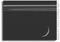 Crescent Dione and Saturn's Rings