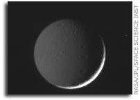 Tethys Bathed in Saturn's Glow and Sunlight