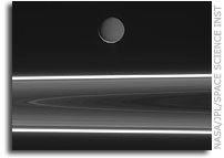 Enceladus Rises Above Saturn's Rings