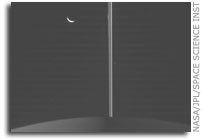 Tethys and A Darkened Saturn