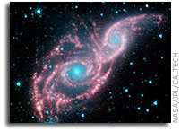 Galaxies Don Mask of Stars in New NASA Spitzer Image