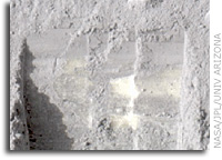 Bright Chunks at NASA Phoenix Lander�s Mars Site Must Have Been Ice