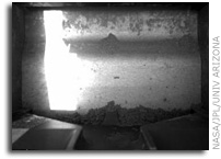 Phoenix Mars Lander Rasps Frozen Layer, Collects Sample