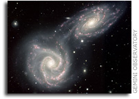 Siamese Twin Galaxies in a Gravitational Embrace