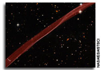 Hubble Sees Stars and a Stripe in Celestial Fireworks