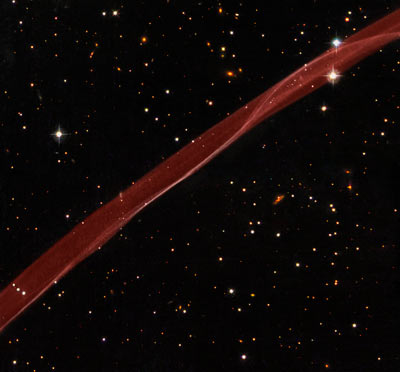 Hubble Sees Stars and a Stripe in Celestial Fireworks