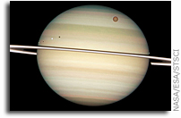 Four of Saturn's moons parade by their parent