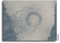 Space Station Image: A circle in thin ice in Lake Baikal, Russia