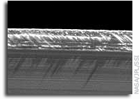 Cassini Sees Saturn Rings Oscillate Like Mini-Galaxy
