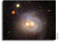 Nearby galaxy boasts 2 monster black holes, both active