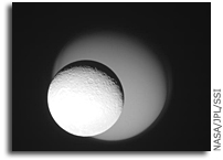 Cassini Image: Rhea Passes In Front of Titan