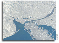 Two Photos: New York City After A Blizzard - As Seen From Orbit