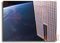 Photo: Space Station Solar Array Points Down at Earth