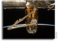 Photo: Kounotori2 H-II Transfer Vehicle Docked at ISS and Grappled by Candarm2