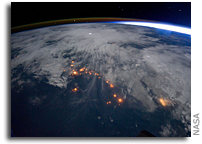 Photo: Clouds, Lightning, Airglow, and Lights of Civilization in Africa As Seen From Space