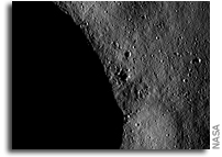 NASA Dawn Image of Asteroid Vesta: Blocks of ejected material and small craters near a crater rim