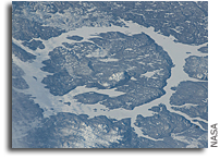 Photo: Impact Crater: Manicouagan Reservoir in Quebec, Canada As Seen From Orbit