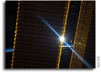 Photo: Space Station Solar Arrays Catch a Sunrise