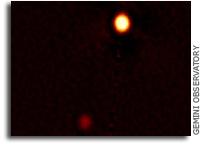 Hybrid Fluid/Kinetic Modeling of Pluto's Escaping Atmosphere