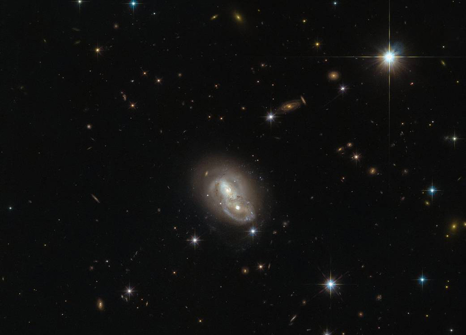 Hubble spots pair of galaxies passing at high speed Hubble spots pair of galaxies passing at high speed